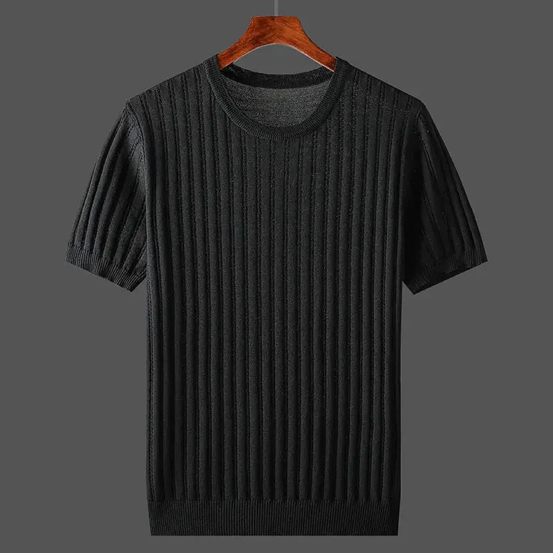 A black, short-sleeve, ribbed knit sweater with a classic fit is displayed on a wooden hanger against a plain gray background.