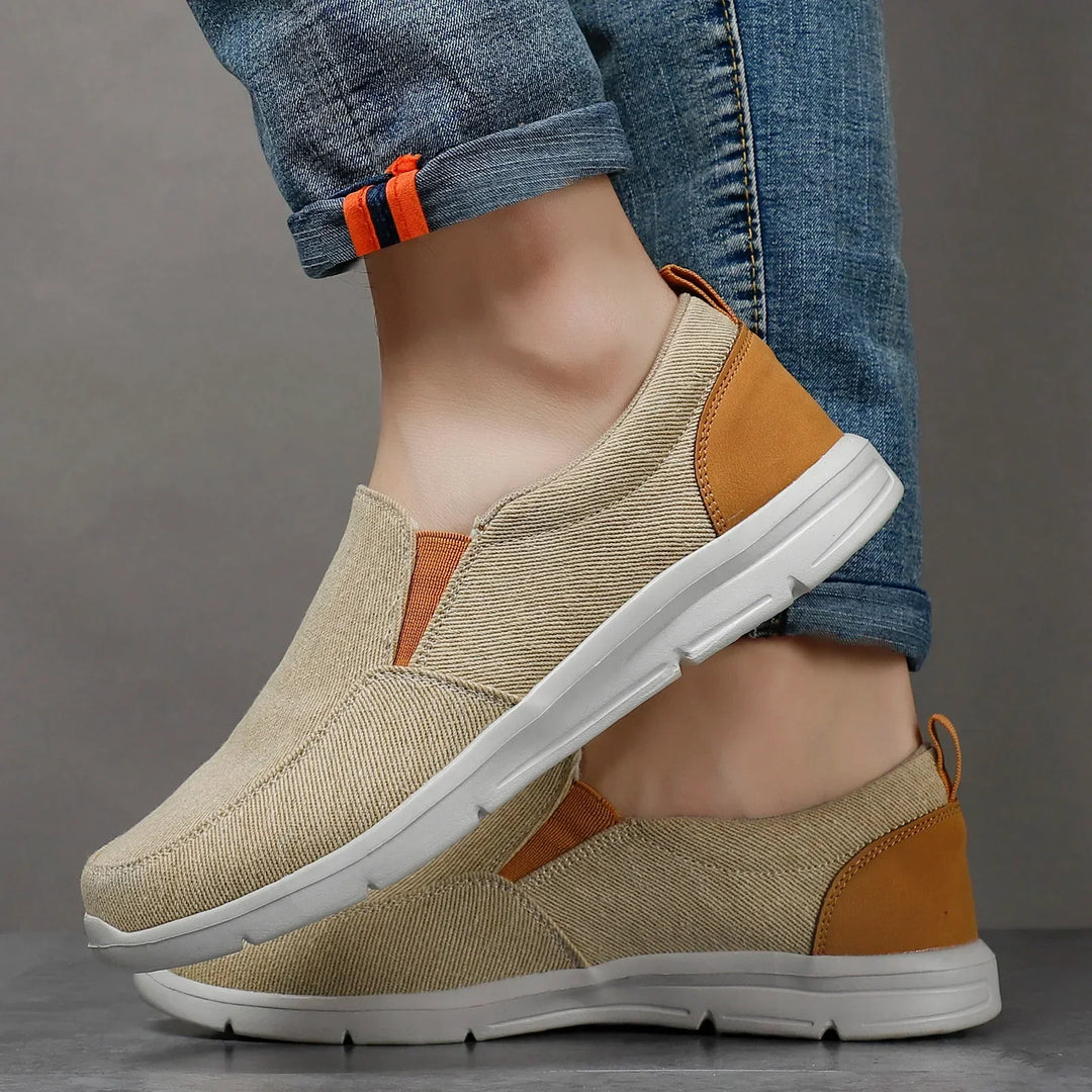 Rovelli beige slip-on casual shoes with white sole and jeans, stylish footwear closeup