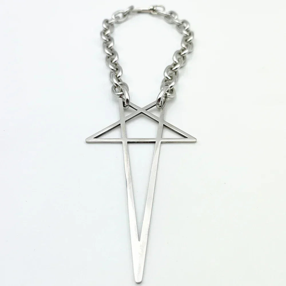 A silver stainless steel necklace features a large geometric pendant shaped like an elongated cross with an intersecting triangle near the top. Modern and minimalist, this pendant necklace makes a striking addition to streetwear jewelry collections.