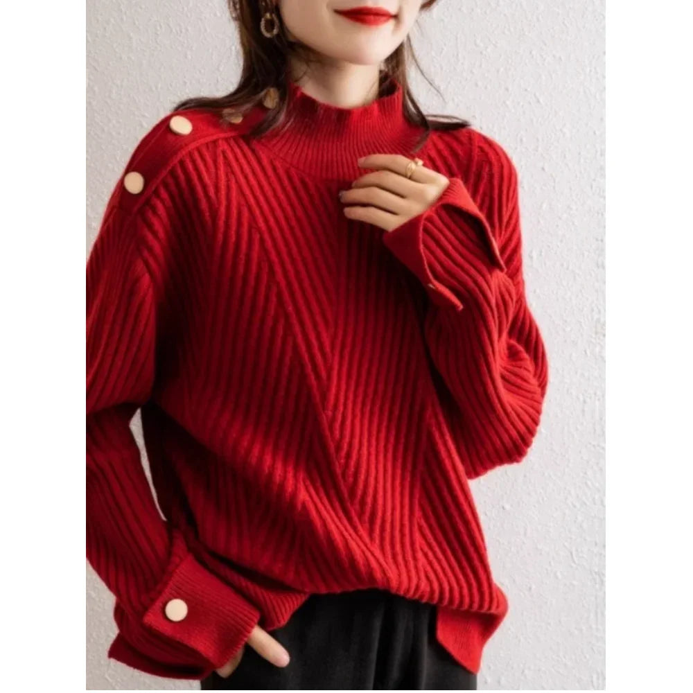 Woman wearing a Rovelli red ribbed knit sweater with button details on shoulder and sleeve