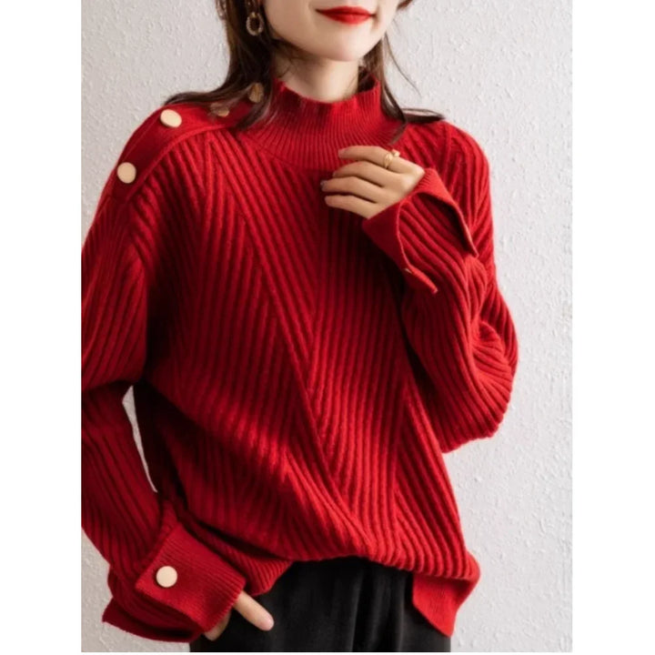 Woman wearing a Rovelli red ribbed knit sweater with button details on shoulder and sleeve