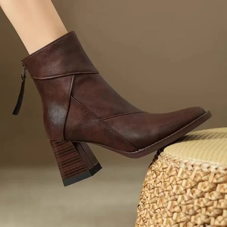 Rovelli brown leather ankle boot with block heel and side zipper on neutral background
