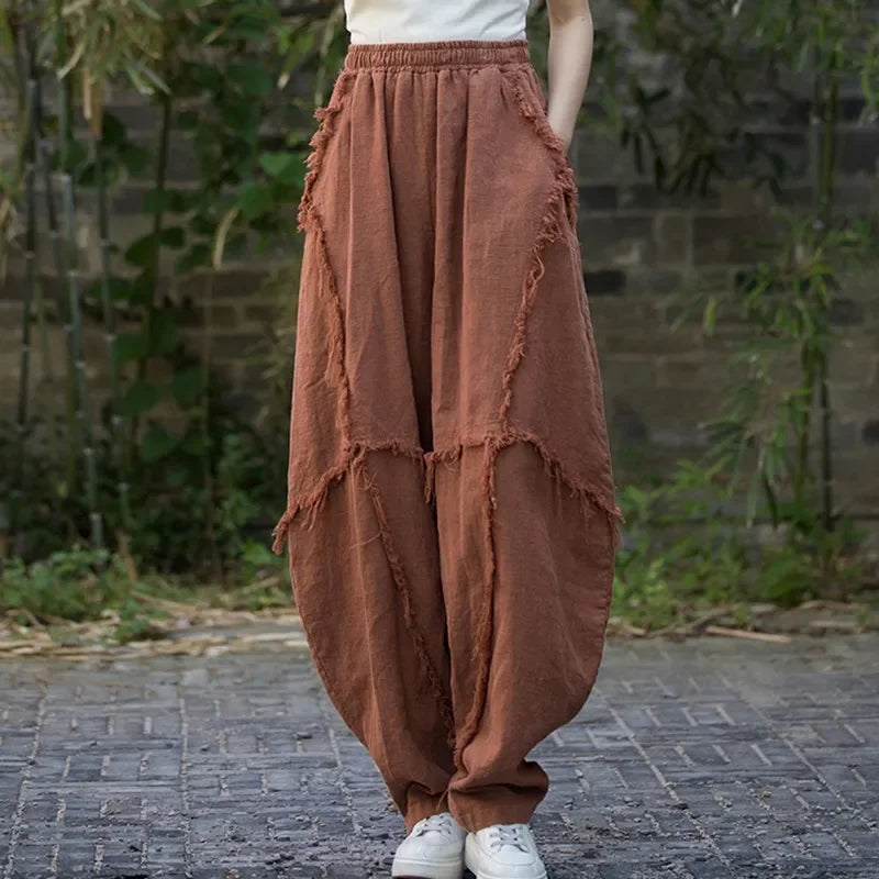 Rovelli brown wide leg linen pants with raw-edged seams, outdoor casual style