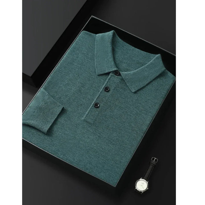 Folded green Rovelli polo shirt with black buttons and a watch on a black background