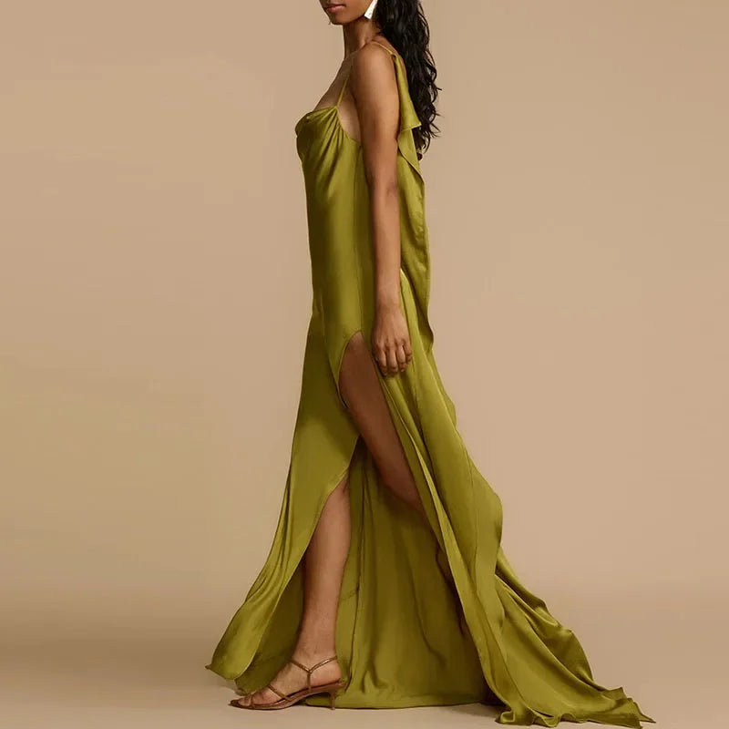 Woman in elegant olive green satin dress with high slit, wearing sandals, Rovelli fashion