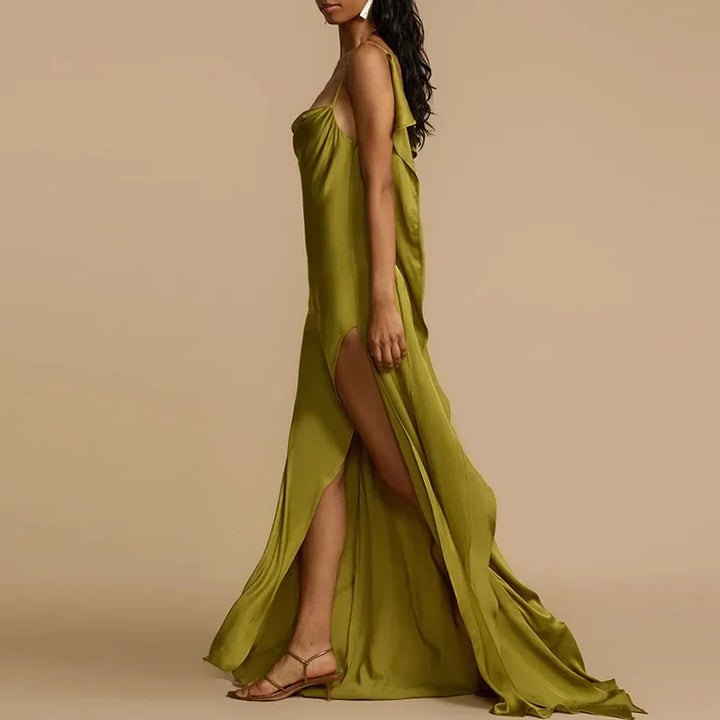 Woman in elegant olive green satin dress with high slit, wearing sandals, Rovelli fashion