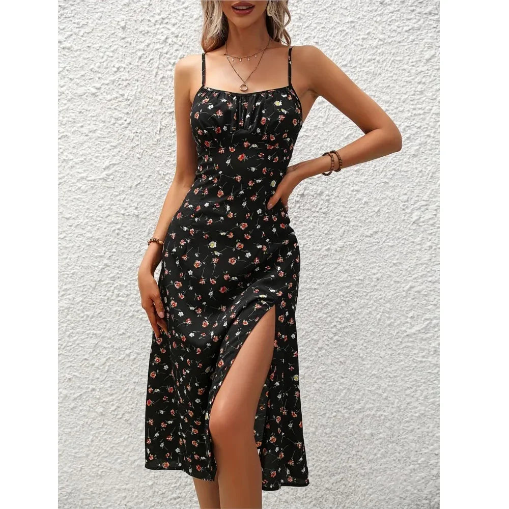 Woman wearing black floral sleeveless dress with side slit, Rovelli fashion