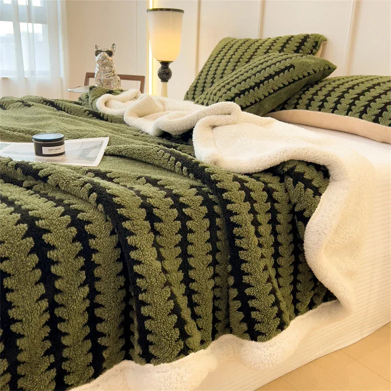 Rovelli olive green and black sherpa blanket and pillows on modern bed in cozy bedroom