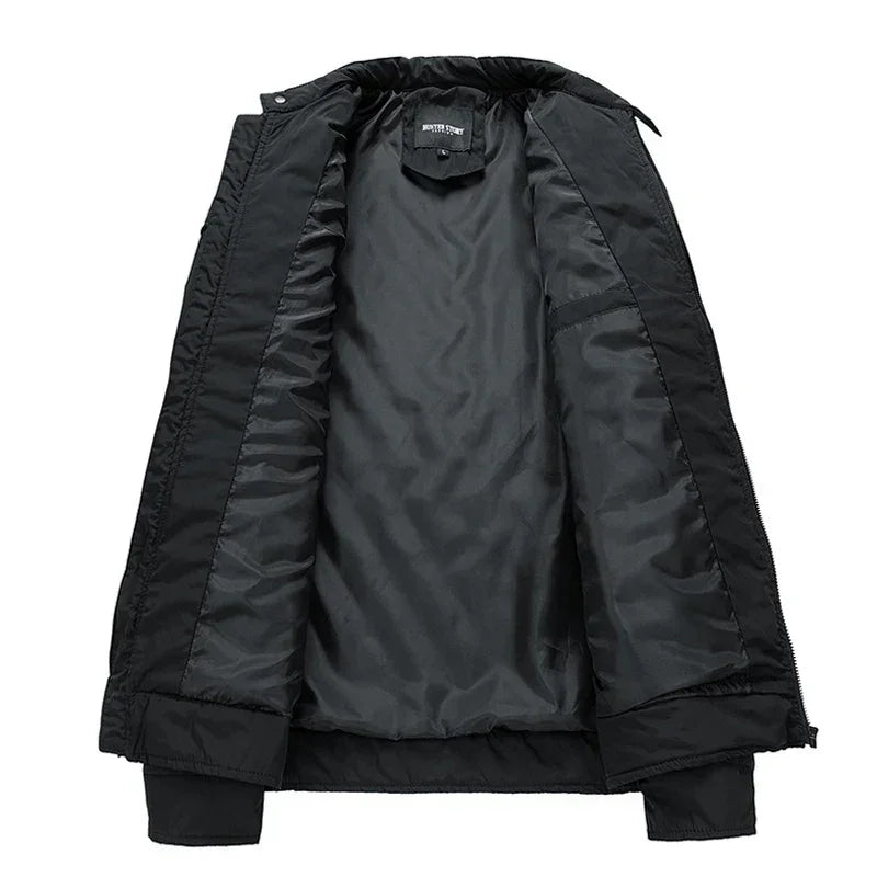 Black slim-fit jacket displayed open to show its smooth, dark inner lining, with ribbed cuffs and a collar. Lightweight and wind-resistant, it’s perfect for casual, everyday wear.