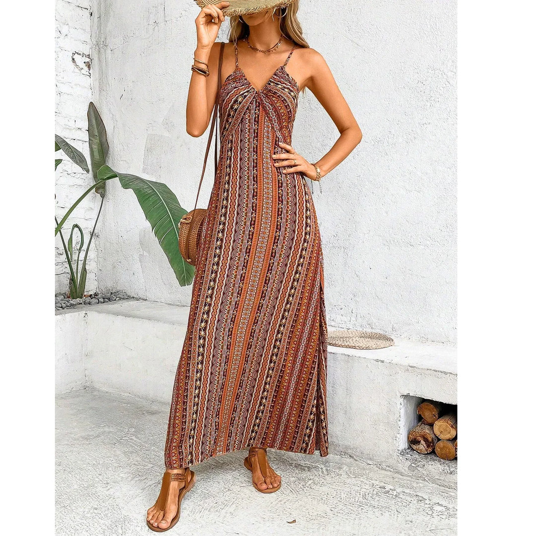 Woman wearing boho maxi sundress with tribal print, straw hat and sandals, Rovelli fashion
