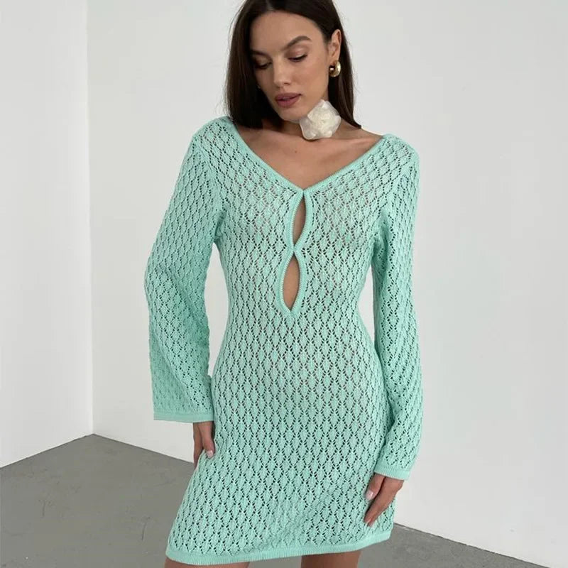 Woman wearing mint green crochet knit dress with long sleeves, Rovelli fashion style