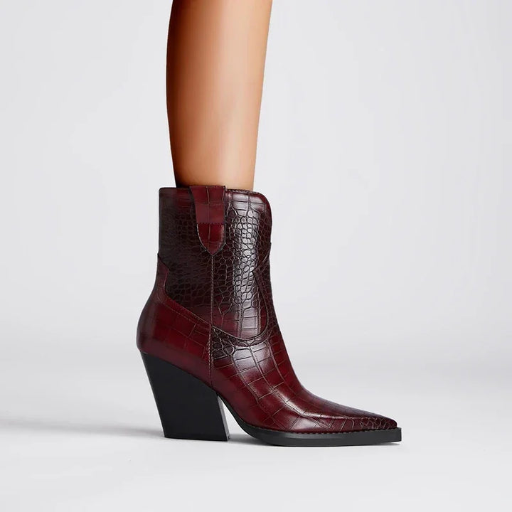 Rovelli dark red crocodile-embossed ankle boot with block heel on model foot
