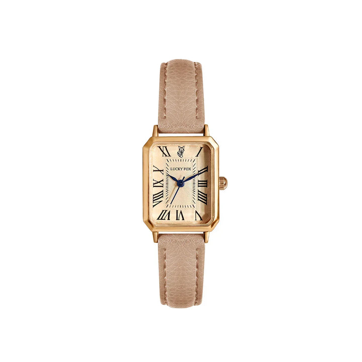 A gold rectangular face watch with a genuine leather strap, Roman numeral hour markers, and blue hands on a white face, displayed against a plain white background.