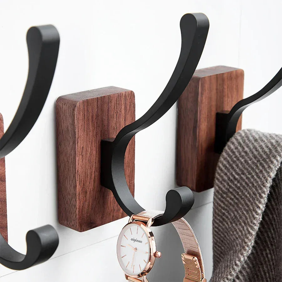 Rovelli modern wall hooks with wooden base, holding a wristwatch and scarf