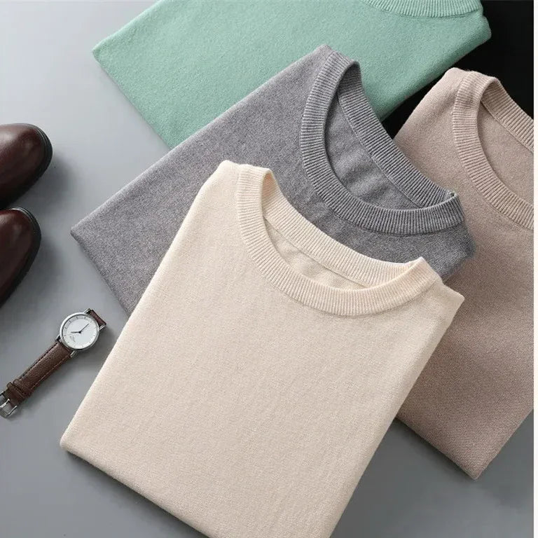 Folded Rovelli crew neck sweaters in cream, gray, beige, and green with watch and shoes