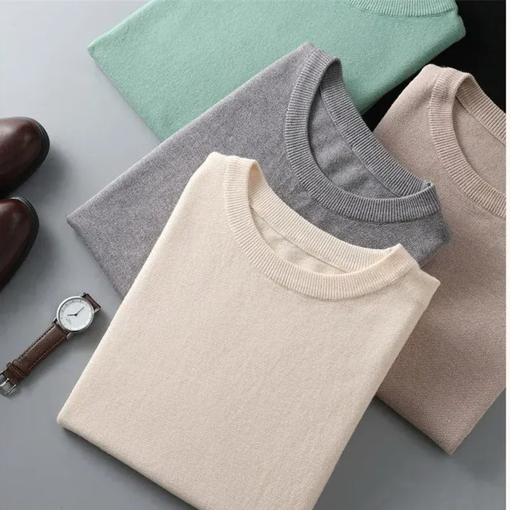 Folded Rovelli crew neck sweaters in cream, gray, beige, and green with watch and shoes