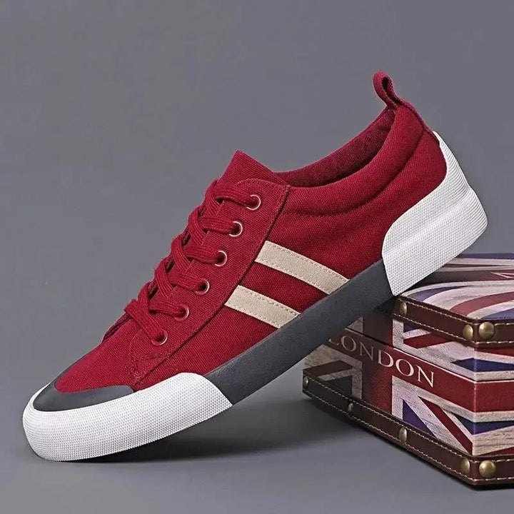 Rovelli red canvas sneaker with white stripes and rubber sole on decorative box