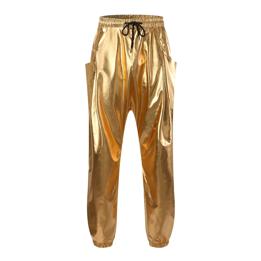 Shiny gold jogger pants made from lightweight metallic fabric, featuring an elastic waistband, black drawstring, side pockets, and elastic cuffs at the ankles.