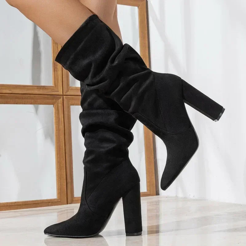 Rovelli black suede slouchy heeled boots with pointed toe and block heel on model
