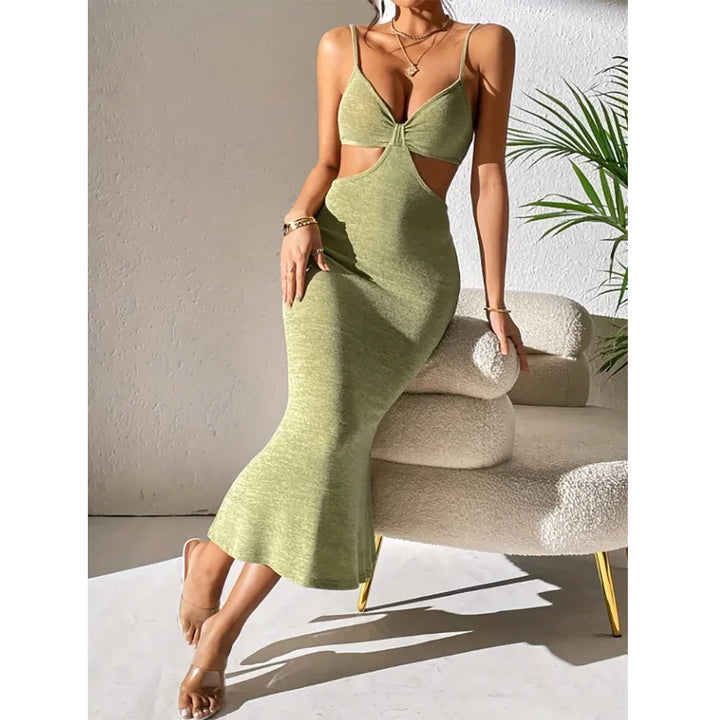 Woman wearing light green cutout bodycon dress from Rovelli, sitting on modern cream chair