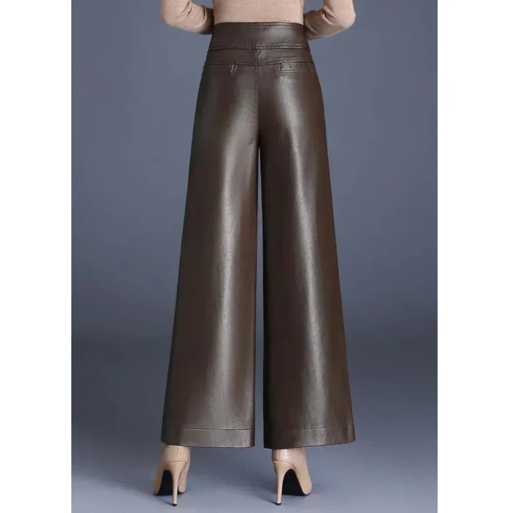 Rovelli brown wide-leg faux leather pants with high waist, model wearing nude heels