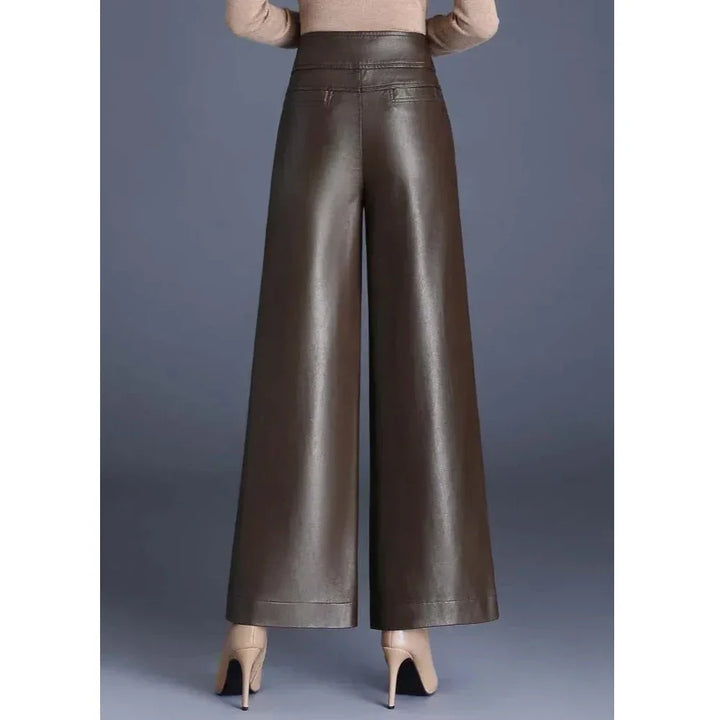 Rovelli brown wide-leg faux leather pants with high waist, model wearing nude heels