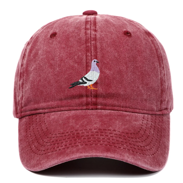 Rovelli red washed baseball cap with embroidered pigeon design on front