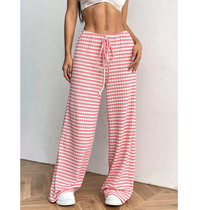 Woman wearing Rovelli pink and white gingham wide-leg pants with drawstring waist