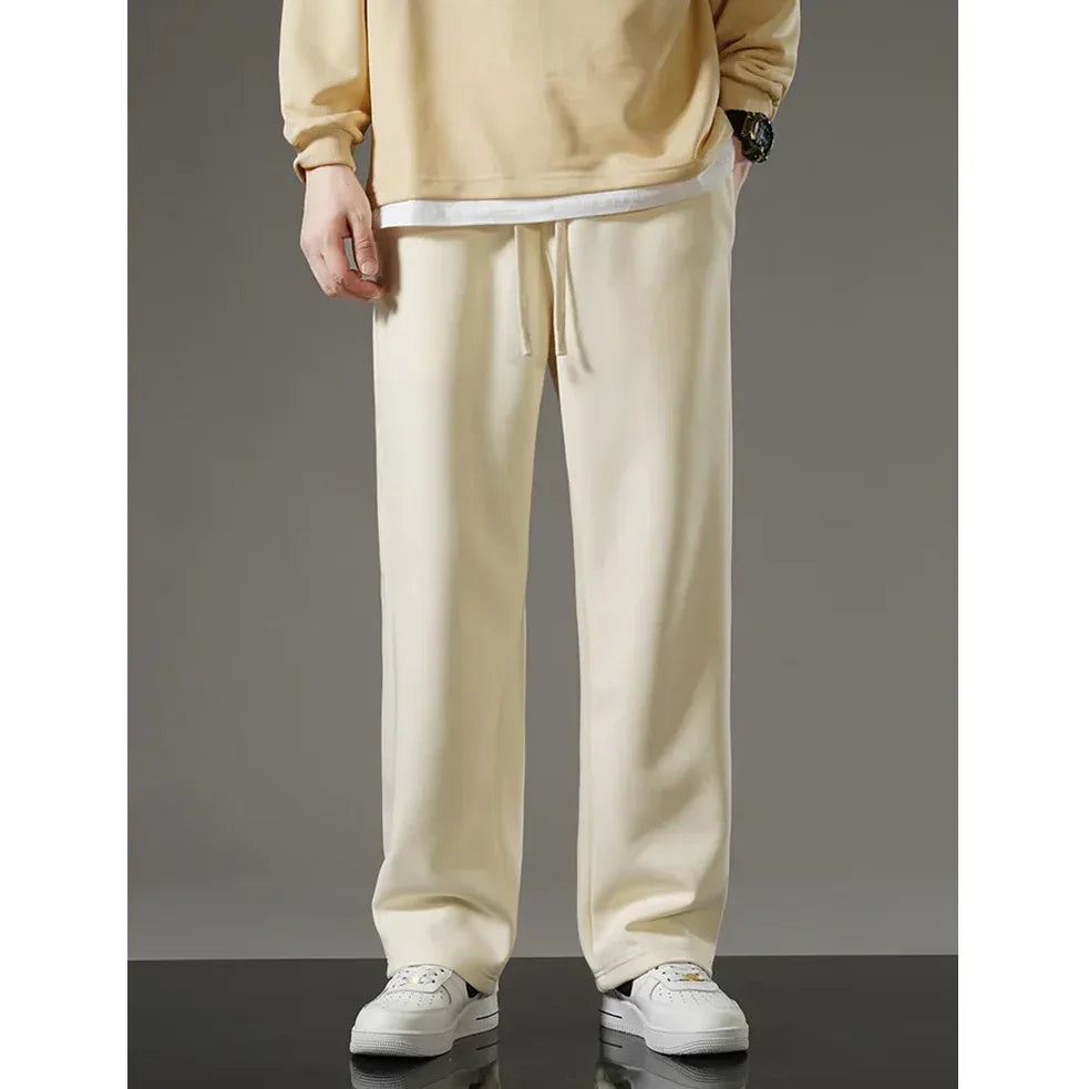 Rovelli cream sweatpants with drawstring waist and white sneakers, casual style