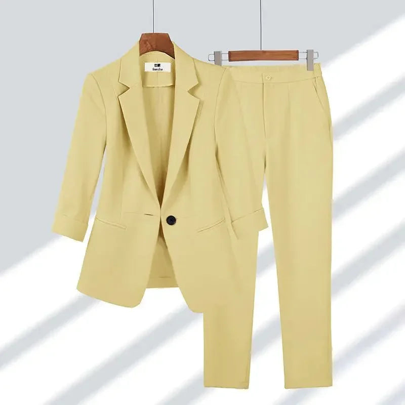 Rovelli light yellow women's blazer and pants suit set on hangers