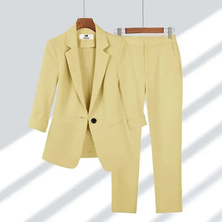 Rovelli light yellow women's blazer and pants suit set on hangers