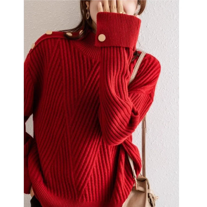 Woman wearing a red ribbed knit sweater with gold buttons from Rovelli