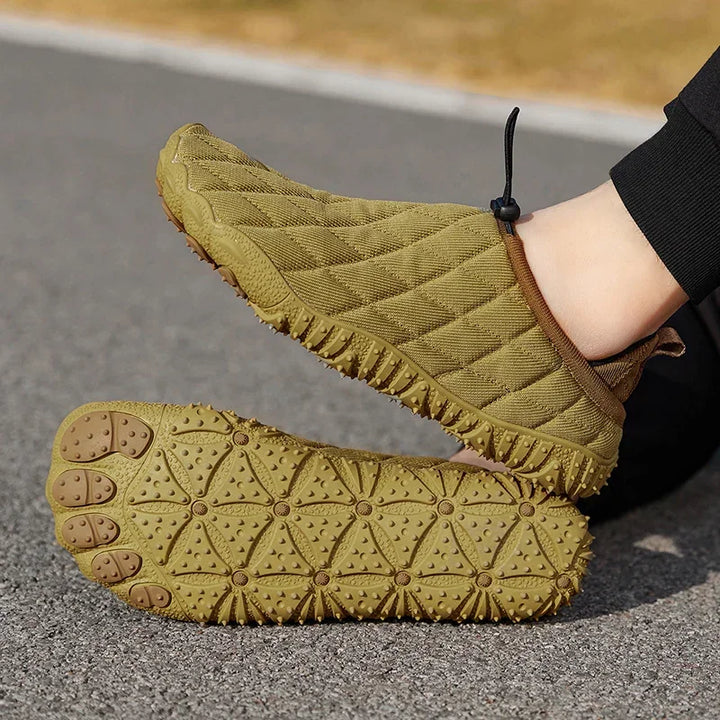 Rovelli olive green barefoot running shoes with textured sole on outdoor pavement