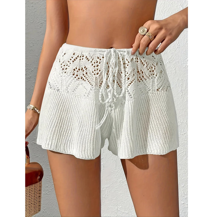 Woman wearing white crochet knit shorts with drawstring from Rovelli