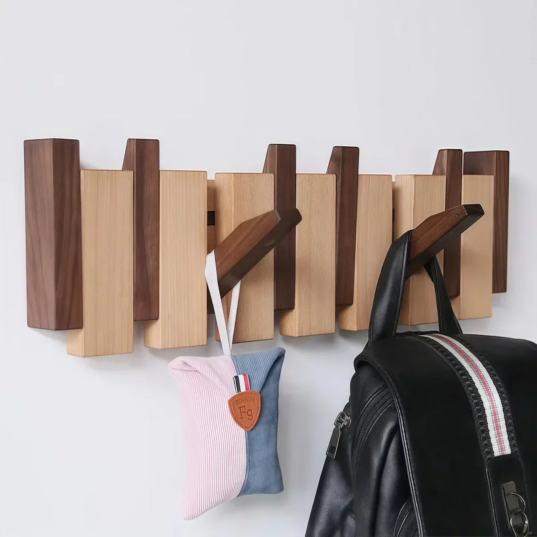 Rovelli modern wooden wall hook rack holding a handbag and cushion pouch