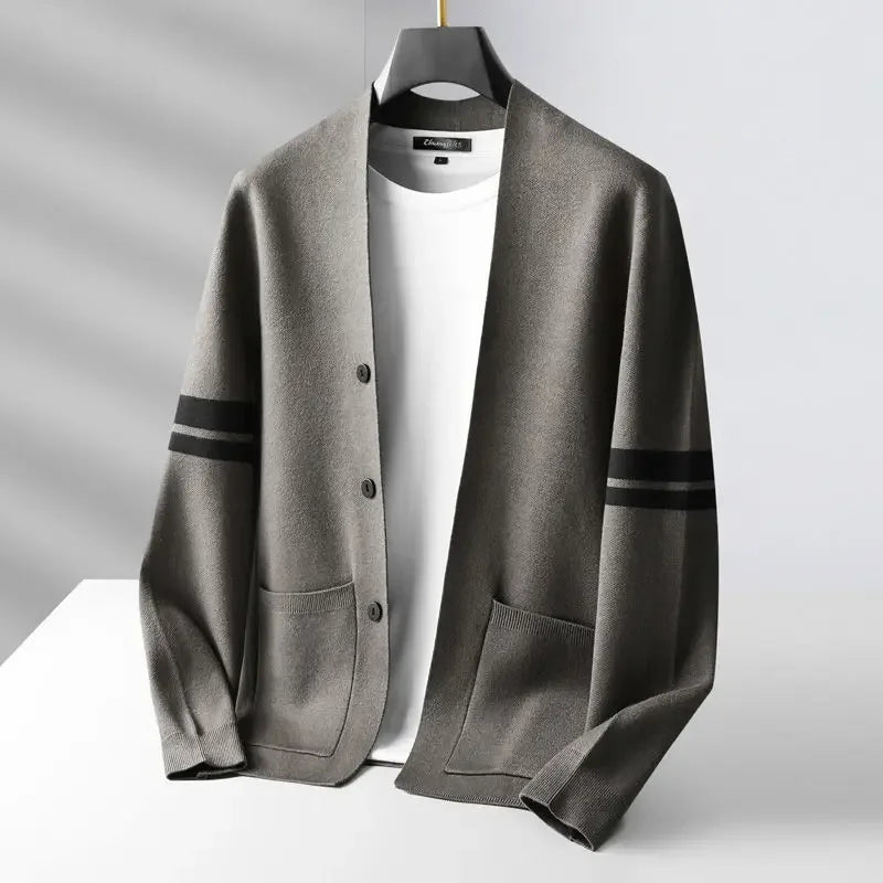 Rovelli gray cardigan with black stripes, white shirt underneath, on hanger