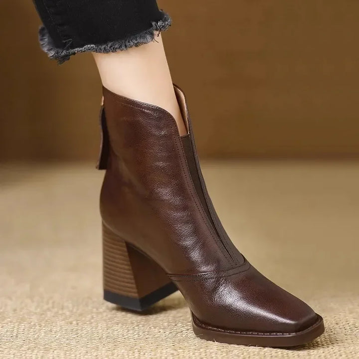 Rovelli brown leather ankle boot with block heel and square toe, worn with black jeans