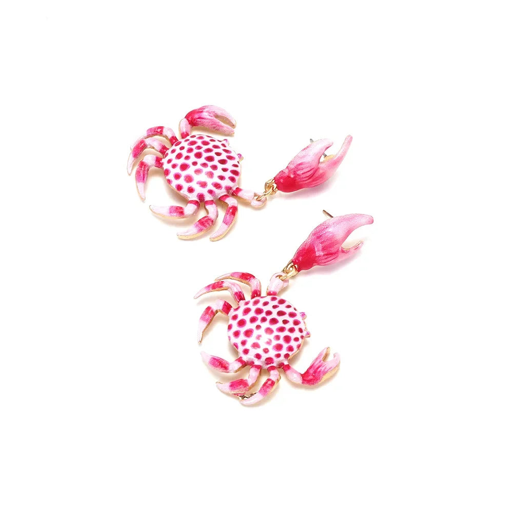Pink crab-shaped earrings with spotted shells on white background, Rovelli jewelry accessory