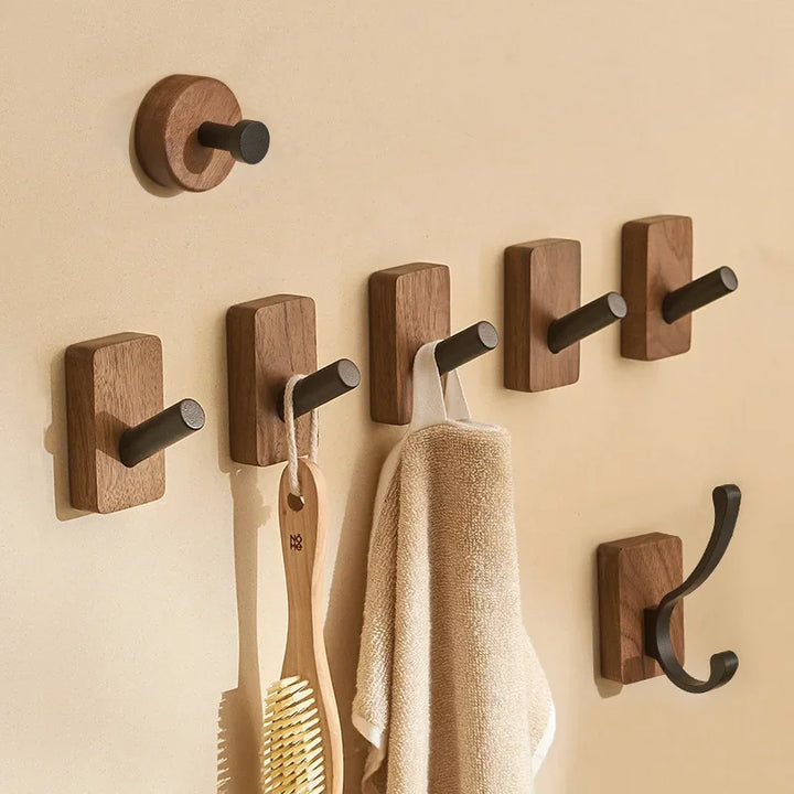 Rovelli modern wall-mounted wooden hooks with towels and brush in entryway or bathroom