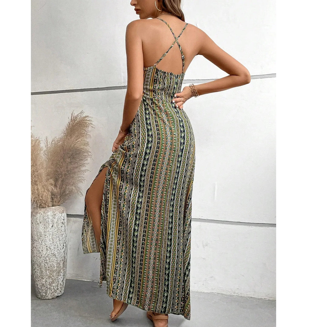 Woman wearing a Rovelli patterned maxi dress with criss-cross straps and side slit