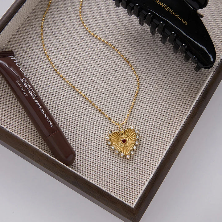 Rovelli gold heart pendant necklace with crystal accents in jewelry box