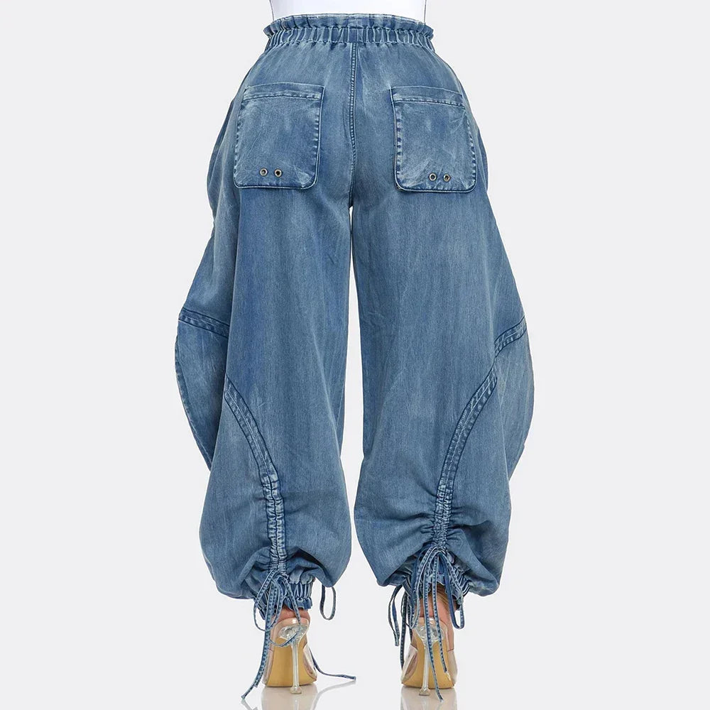 Back view of wide-leg denim pants with drawstring hem and large back pockets, Rovelli fashion
