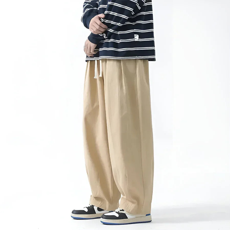 Rovelli beige wide-leg pants with drawstring, styled with striped shirt and sneakers