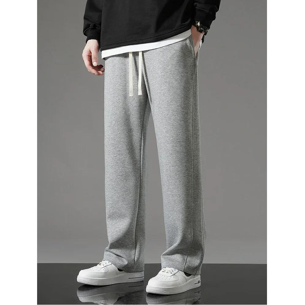 Rovelli grey sweatpants with drawstring waist styled with white sneakers