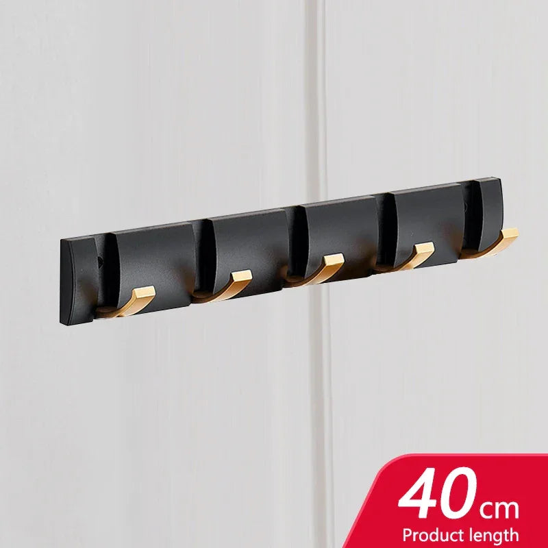 Rovelli black wall hook rack with gold hooks, 40 cm, mounted on white wall