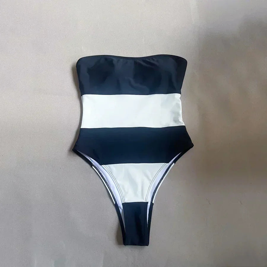 Rovelli black and white strapless striped one-piece swimsuit on neutral background