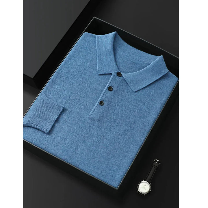 Rovelli folded blue polo shirt with black buttons and a wristwatch on sleek black background