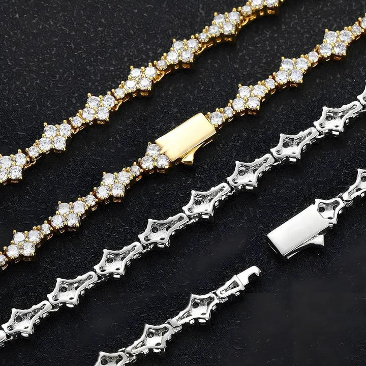 Gold and silver Rovelli tennis bracelets with round gemstones on black background