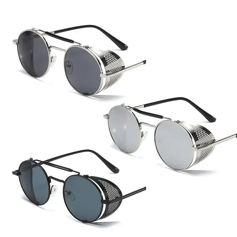 Three pairs of steampunk sunglasses with flip round metal frames and windproof mesh side shields in dark gray, clear, and black lenses. Each pair features silver frames and black temple arms, stylishly displayed on a white background.