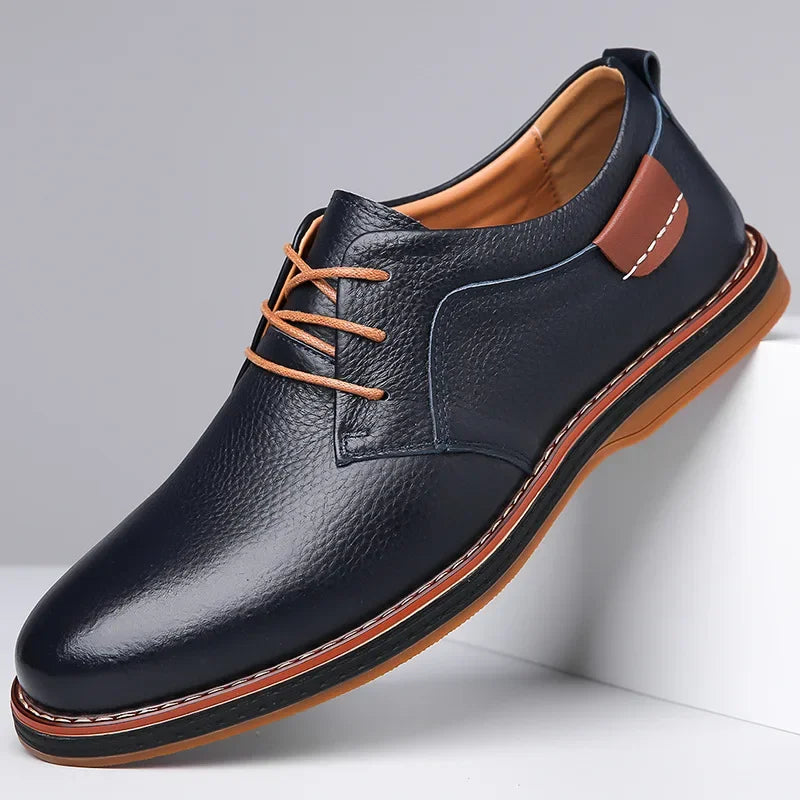Rovelli men's navy leather dress shoe with tan laces and stitched brown sole